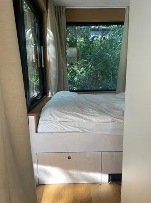 Ein Bett oder Betten in einem Zimmer der Unterkunft Cozy Cabins I Tiny House Seecontainer