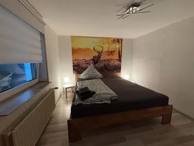 Ein Bett oder Betten in einem Zimmer der Unterkunft Ferienwohnung Beckmann