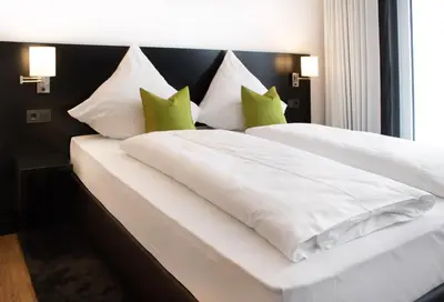 Ein Bett oder Betten in einem Zimmer der Unterkunft HBS Hotel by WMM Hotels