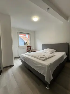 Ein Bett oder Betten in einem Zimmer der Unterkunft Ferienwohnung ENJOY 2