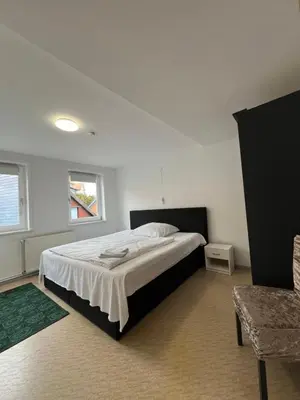Ein Bett oder Betten in einem Zimmer der Unterkunft Ferienwohnung ENJOY 4