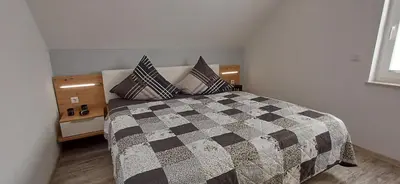 Ein Bett oder Betten in einem Zimmer der Unterkunft Premiumferienhaus Prana