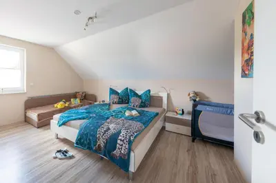 Ein Bett oder Betten in einem Zimmer der Unterkunft Ferienhaus Arisa II