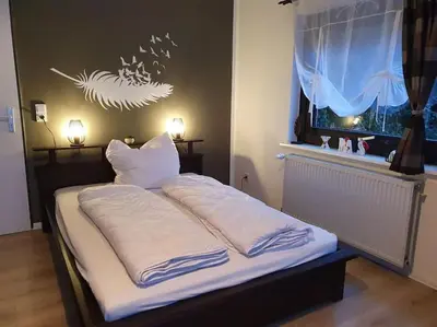 Ein Bett oder Betten in einem Zimmer der Unterkunft 1 Raum-Ferienwohnung am Rosenberg