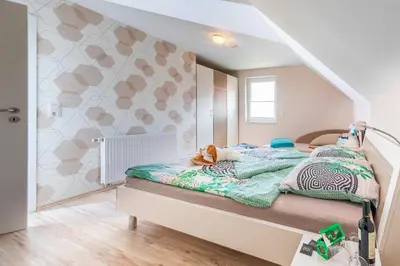 Ein Bett oder Betten in einem Zimmer der Unterkunft Ferienhaus Freya