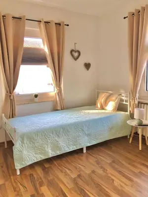 Ein Bett oder Betten in einem Zimmer der Unterkunft Ferienwohnungen Am Klusteich