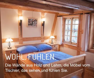 Ein Bett oder Betten in einem Zimmer der Unterkunft Das Ferienhaus Wernigerode - direkt 
