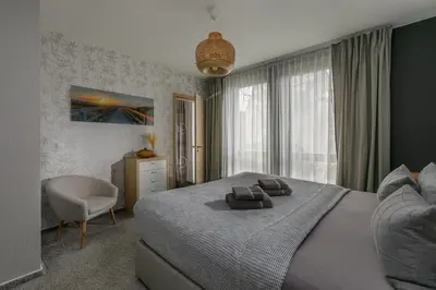 Ein Bett oder Betten in einem Zimmer der Unterkunft Monopol Apartments