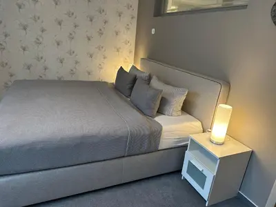 Ein Bett oder Betten in einem Zimmer der Unterkunft Monopol Apartments