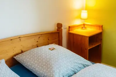 Ein Bett oder Betten in einem Zimmer der Unterkunft Altes Forsthaus Königskrug