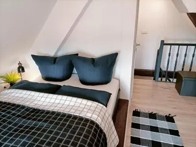 Ein Bett oder Betten in einem Zimmer der Unterkunft Bergsteigerbude