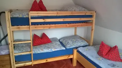 Ein Bett oder Betten in einem Zimmer der Unterkunft Ferienhaus Markgraf