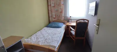 Ein Bett oder Betten in einem Zimmer der Unterkunft Ferienhaus Markgraf