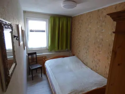 Ein Bett oder Betten in einem Zimmer der Unterkunft Ferienwohnung Harzbiene