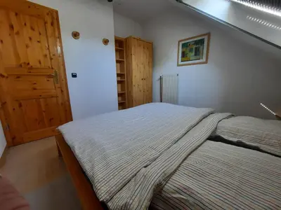 Ein Bett oder Betten in einem Zimmer der Unterkunft HarzZeit - die Ferienwohnung mit 2 Schlafzimmern