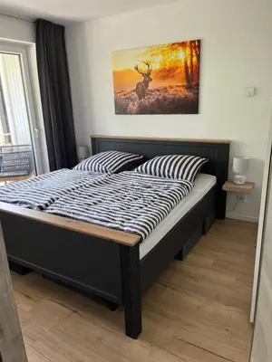 Ein Bett oder Betten in einem Zimmer der Unterkunft Bergliebe Sankt Andreasberg