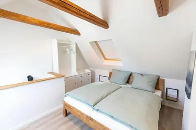 Ein Bett oder Betten in einem Zimmer der Unterkunft Altstadthäuschen