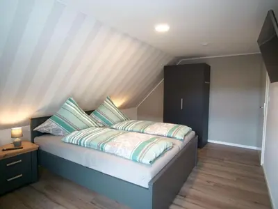 Ein Bett oder Betten in einem Zimmer der Unterkunft Ravensberg
