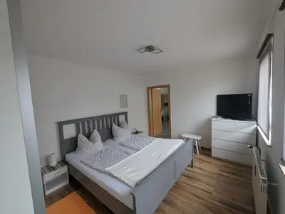 Ein Bett oder Betten in einem Zimmer der Unterkunft FEWO An der Bode
