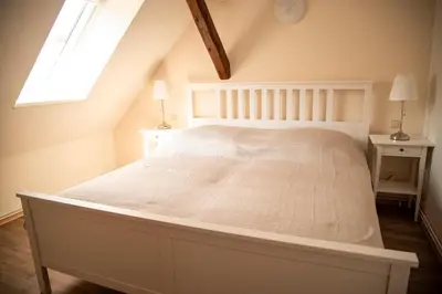 Ein Bett oder Betten in einem Zimmer der Unterkunft Ferienwohnung Up'n Spitzböhn