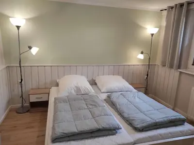 Ein Bett oder Betten in einem Zimmer der Unterkunft Gästehaus Harzklause 1
