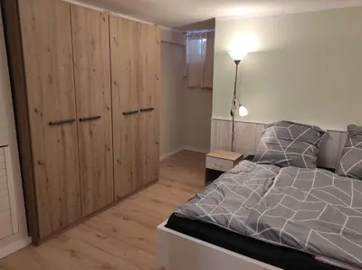 Ein Bett oder Betten in einem Zimmer der Unterkunft Gästehaus Harzklause 2