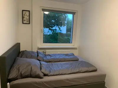 Ein Bett oder Betten in einem Zimmer der Unterkunft MyCha Ferienwohnung