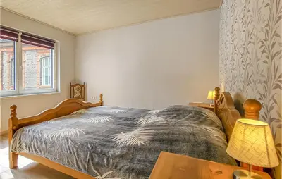 Ein Bett oder Betten in einem Zimmer der Unterkunft 2 Bedroom Amazing Apartment In Stolberg