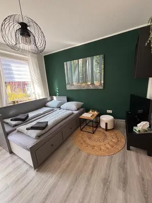 Ein Bett oder Betten in einem Zimmer der Unterkunft FeWo „Am Kanonenberg“