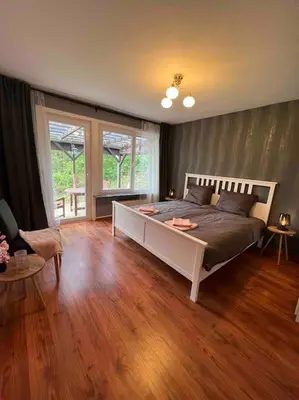 Ein Bett oder Betten in einem Zimmer der Unterkunft Platell Ferienhäuser Harz Wieda