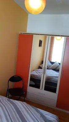 Ein Bett oder Betten in einem Zimmer der Unterkunft ALACARD Ferienwohnungen Höffgen Thale Harz