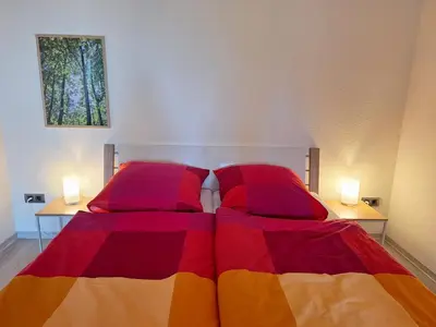 Ein Bett oder Betten in einem Zimmer der Unterkunft Gemütliche Ferienwohnung am Nationalpark Harz mit Parkplatz am Haus