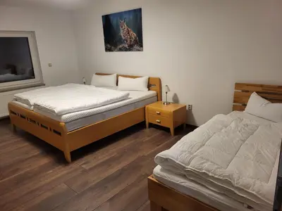 Ein Bett oder Betten in einem Zimmer der Unterkunft Ferienwohnung Kröger II