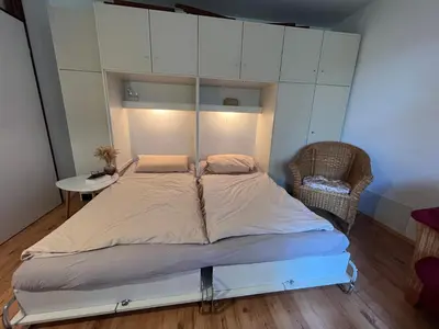 Ein Bett oder Betten in einem Zimmer der Unterkunft Moderne und zentral gelegene Ferienwohnung in Braunlage mit Rodelpiste und Start Ski Langlauf in 300 Metern Entfernung