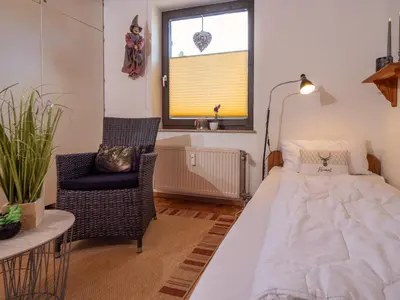 Ein Bett oder Betten in einem Zimmer der Unterkunft Ferienwohnung am Kurpark