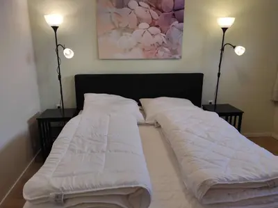 Ein Bett oder Betten in einem Zimmer der Unterkunft Gästehaus Harzklause 4