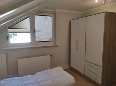 Ein Bett oder Betten in einem Zimmer der Unterkunft Gästehaus Harzklause 6