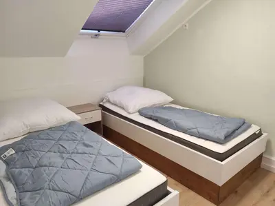 Ein Bett oder Betten in einem Zimmer der Unterkunft Gästehaus Harzklause 7