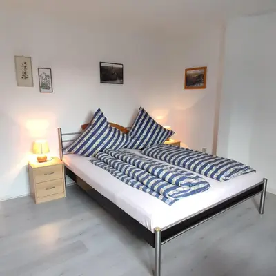 Ein Bett oder Betten in einem Zimmer der Unterkunft Gästehaus Familie Rinke