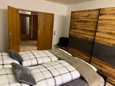 Ein Bett oder Betten in einem Zimmer der Unterkunft Ferienhaus International 2