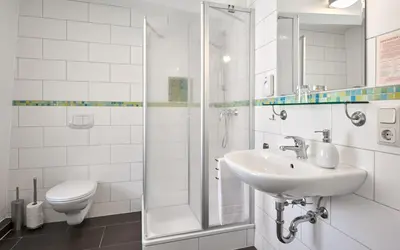Ein Badezimmer in der Unterkunft Pension-Ristorante Ventura ehemals Reinhards Pension