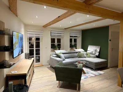 Ein Sitzbereich in der Unterkunft Lillis Cottage