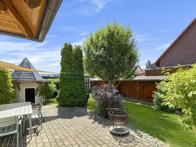 Ein Garten an der Unterkunft Kupferschmiede - Weber Grill - Feuerkorb - Terrasse - Indoorschaukel - Ideal für Familien