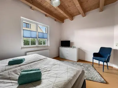 Ein Bett oder Betten in einem Zimmer der Unterkunft Kupferschmiede - Weber Grill - Feuerkorb - Terrasse - Indoorschaukel - Ideal für Familien