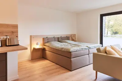 Ein Bett oder Betten in einem Zimmer der Unterkunft Sonnenberg