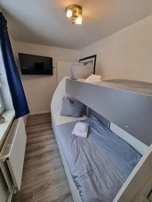 Ein Bett oder Betten in einem Zimmer der Unterkunft Haus Ilse Wohnung 8