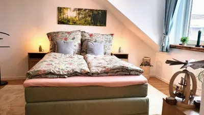 Ein Bett oder Betten in einem Zimmer der Unterkunft Ferienwohnung Berglodge 22