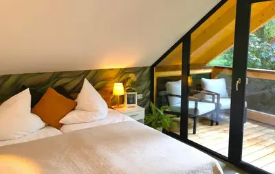 Ein Bett oder Betten in einem Zimmer der Unterkunft DAS Chalet mit Schlossblick in Wernigerode