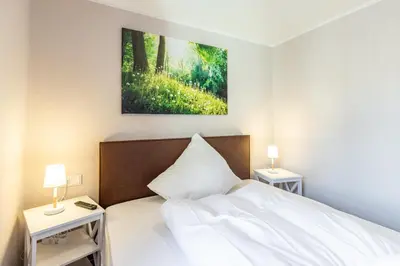 Ein Bett oder Betten in einem Zimmer der Unterkunft Ferienwohnungen am Kornmarkt II