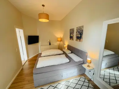 Ein Bett oder Betten in einem Zimmer der Unterkunft COZY, neue 3 Zimmer Ferienwohnung Goslar Altstadt